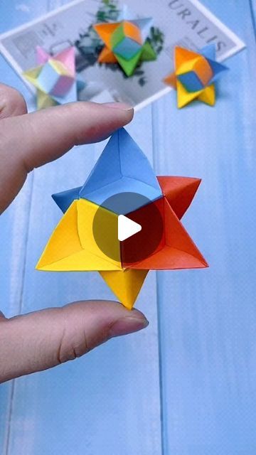 someone is holding an origami star in their hand and it looks like they have been made out of paper