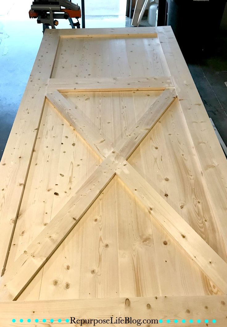 an unfinished table top with some wood planks on it