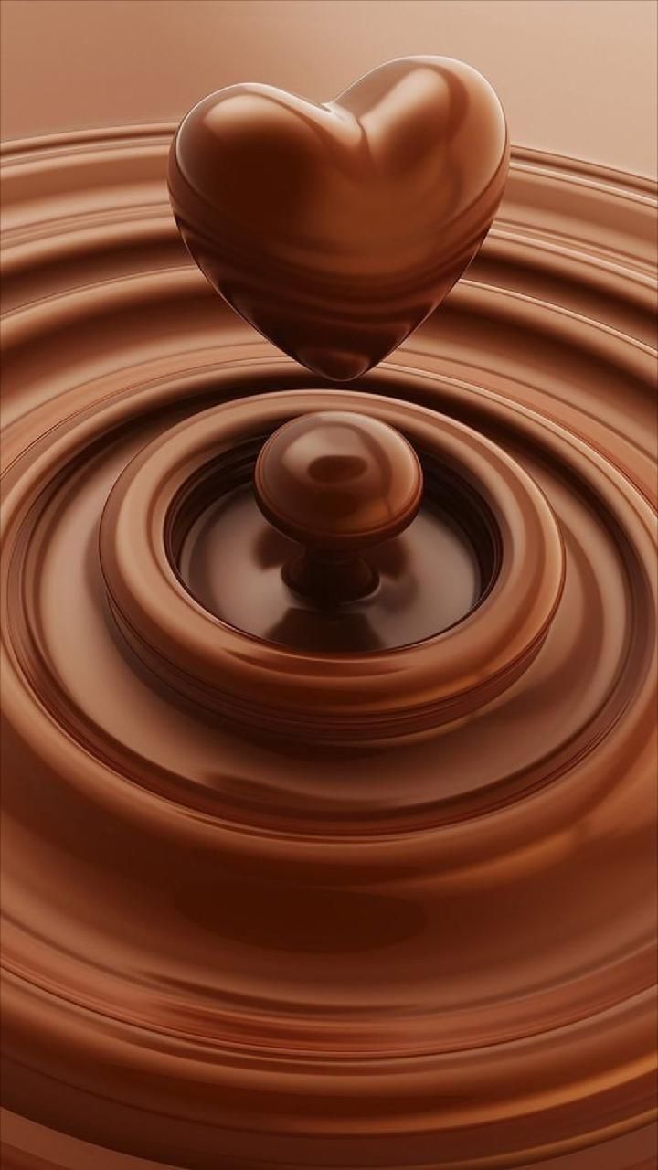 a chocolate heart floating on top of water