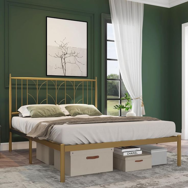 a bed with two storage drawers underneath it in a green room next to a window