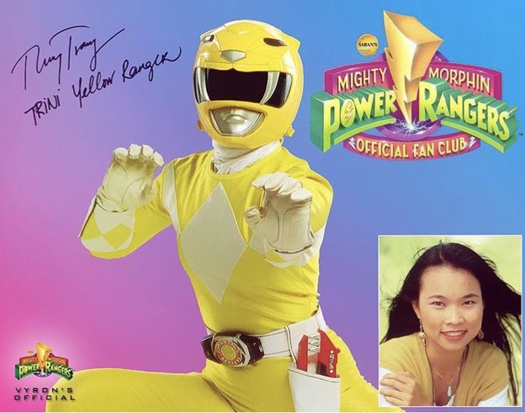 the power rangers character is posing for a photo with an autographed image behind it