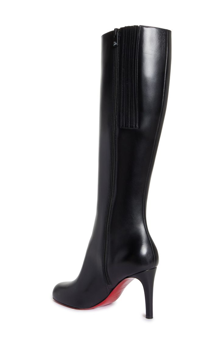 New to the maison's lineup of sleek, sophisticated footwear comes this timeless knee-high boot whose rounded toe balances the stiletto heel. Christian Louboutin's iconic red sole—born from a fateful brush with red nail lacquer—lends distinctive brilliance to every step. 3 1/2" (85mm) heel (size 38.5) 16" shaft; 14 1/4" calf circumference Side zip closure Wipe with a soft, dry cloth and store in a dust bag Please note the red lacquer on soles will wear off as a result of normal use. To minimize the effect, avoid wearing in wet weather or on abrasive surfaces Leather upper, lining and sole Made in Italy Designer Shoes Pointy Boots, Louboutin Boots, Christian Louboutin Boots, Leather Western Boots, Red Lacquer, Red Nail, Red Sole, Wet Weather, Boots Heels