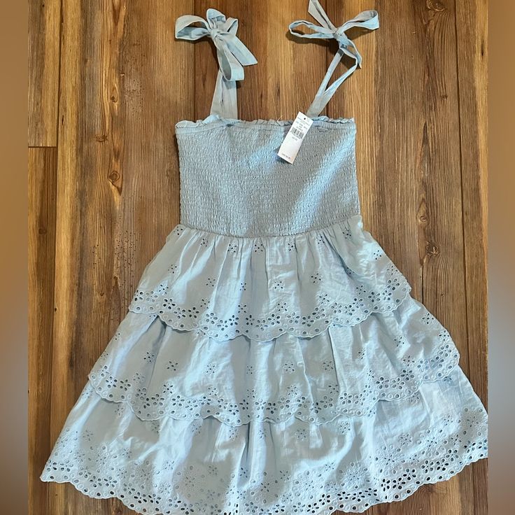 - Size Xs - Nwt - Adjustable/Tieable Straps Blue Mini Dress With Tie Straps For Spring, Blue Cotton Mini Dress With Tie Straps, Long Sleeve Peasant Dress, Black Ribbed Dress, American Eagle Skirt, Blue Plaid Dress, American Eagle Dress, Dusty Rose Dress, Mini Cami Dress