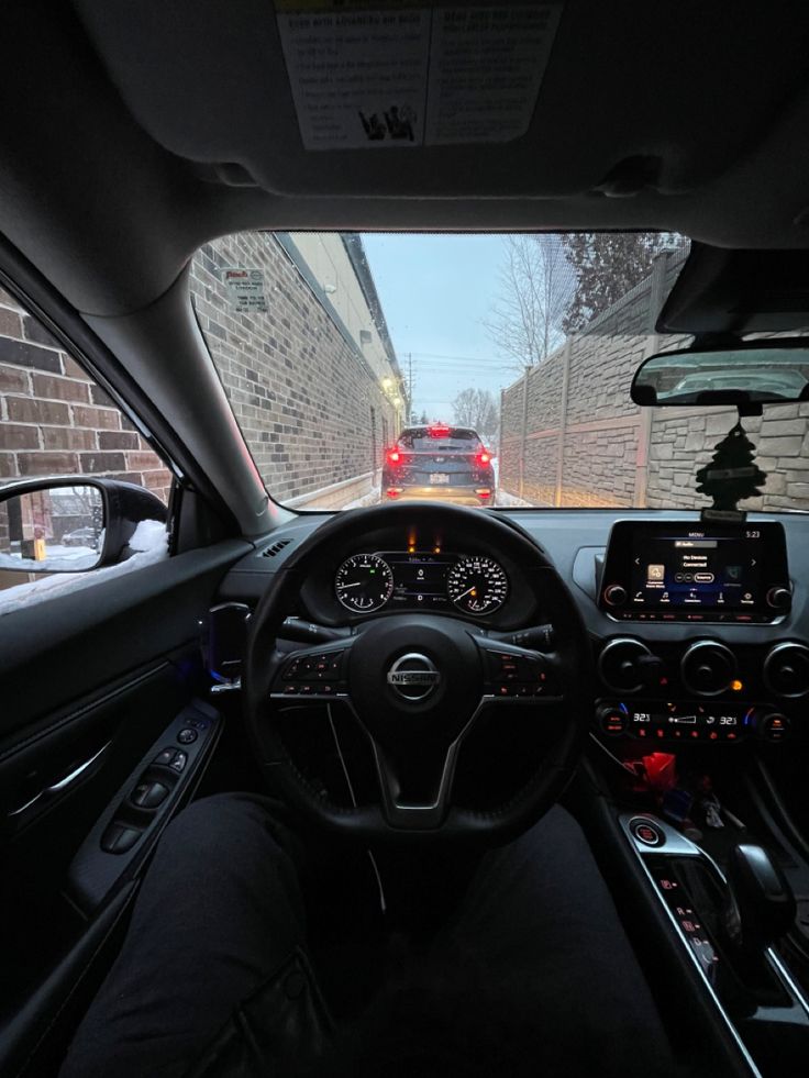 the interior of a car with its dashboard lights on