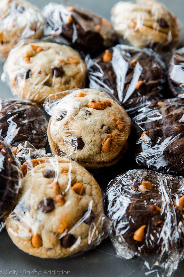 chocolate chip cookies are wrapped in plastic and placed on top of each other, ready to be eaten