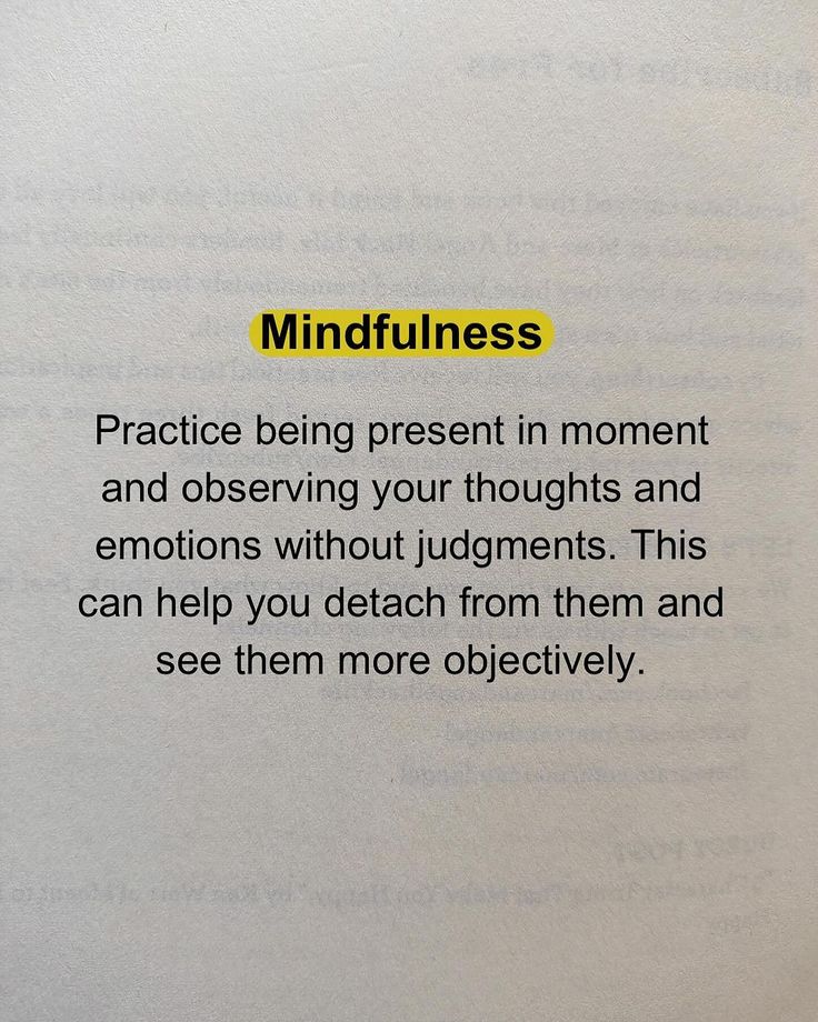 an open book with the words mindfulness written in yellow and black on it