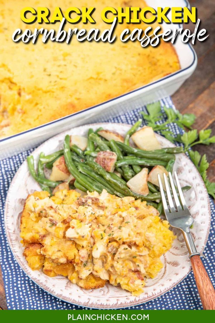 a white plate topped with green beans and chicken covered in cornbread casserole