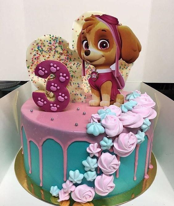 a birthday cake for a girl with a dog on top and flowers in the bottom