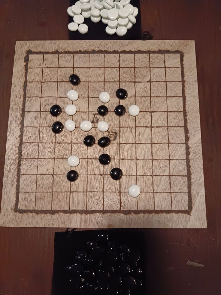 a board game with white and black pieces on it