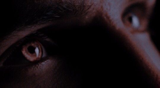 a close up view of the eyes of a man