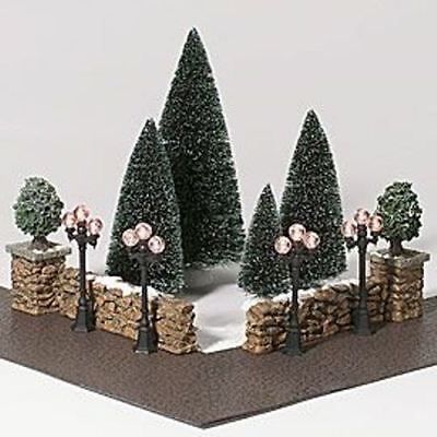 there is a miniature garden with trees and rocks