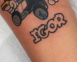 a person with a tattoo on their arm that says bob the builder and an image of mario