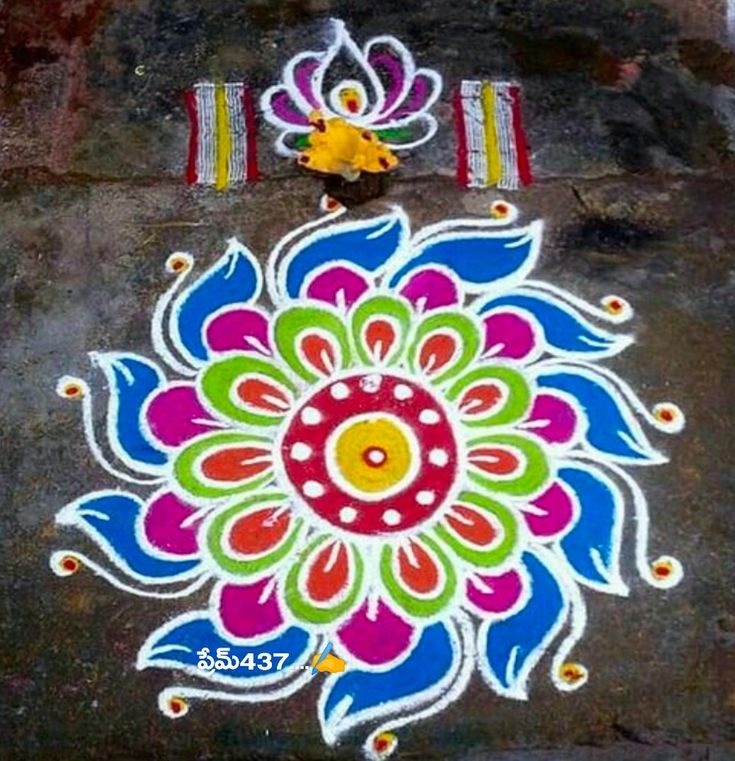 a colorful flower design painted on the ground