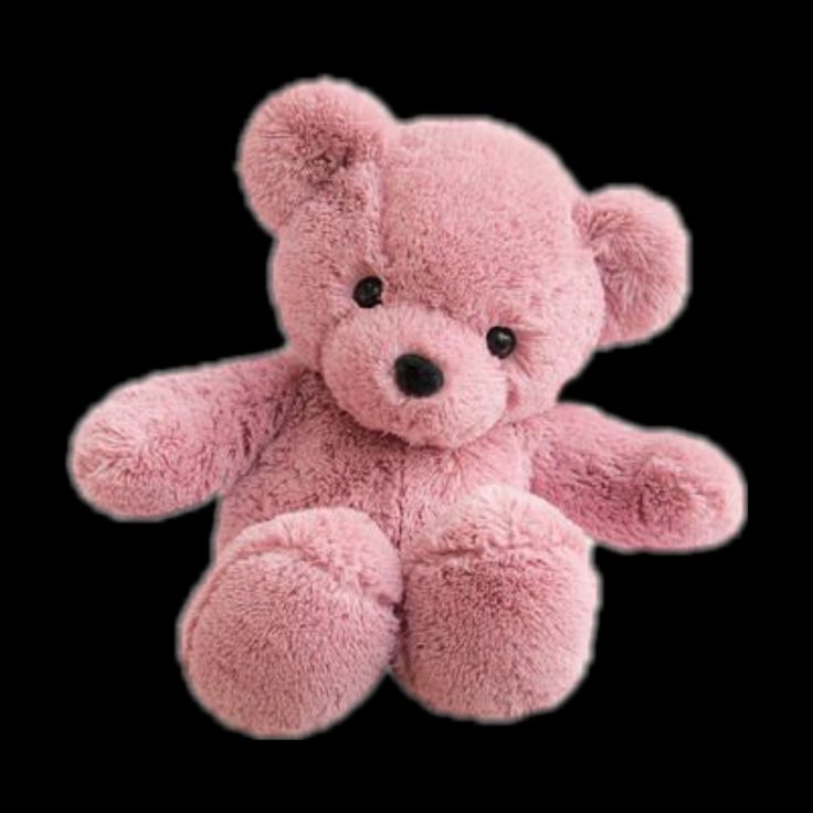 a pink teddy bear sitting on top of a black background with its eyes wide open