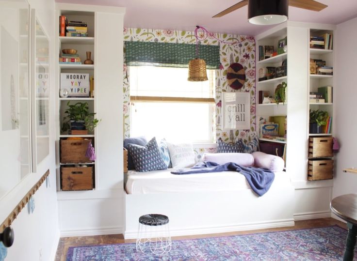 a room with white walls and lots of shelves