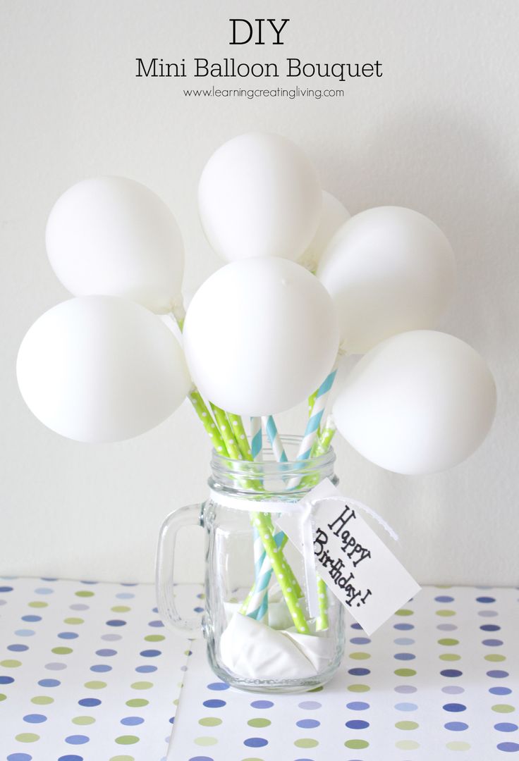 a mason jar filled with eggs and paper straws