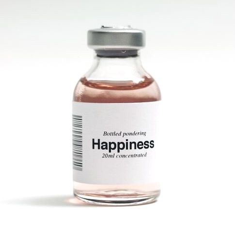 a bottle of happiness sitting on top of a table