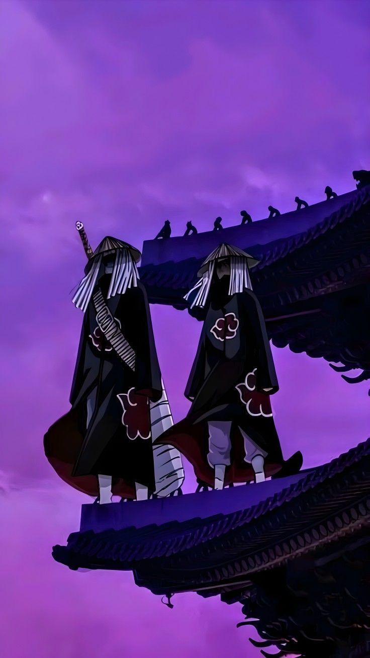 two people dressed in black and white are standing on a roof with purple skies behind them