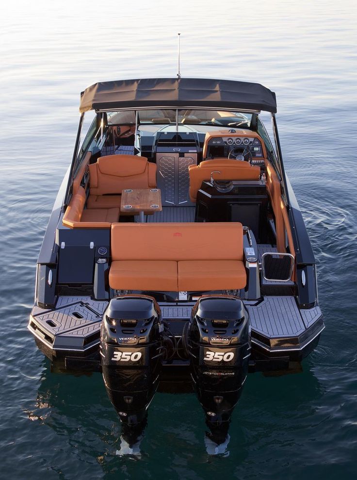 two seats are on the back of a boat in the middle of the water,