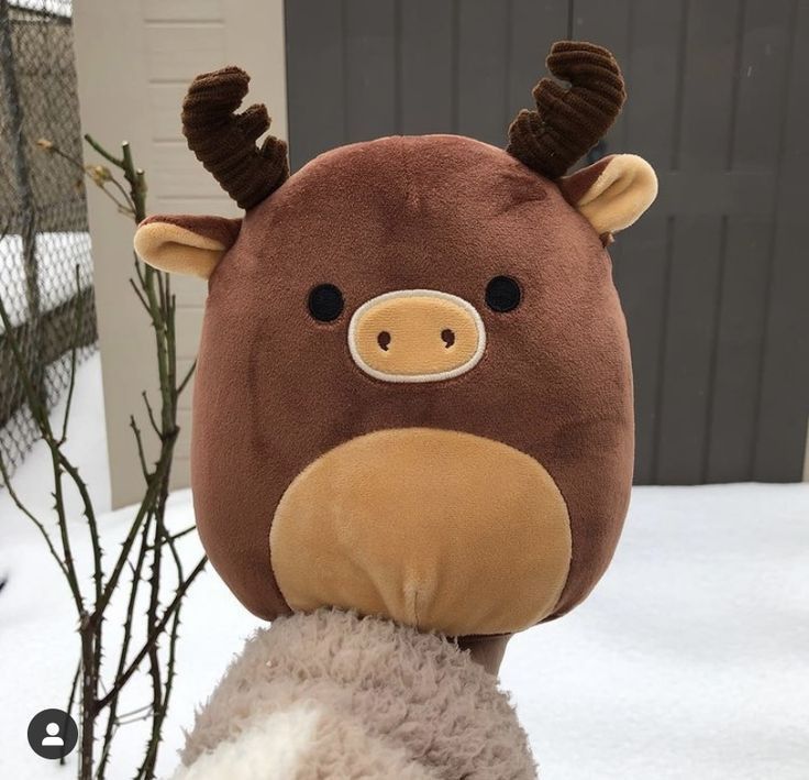 a stuffed animal with antlers on it's head