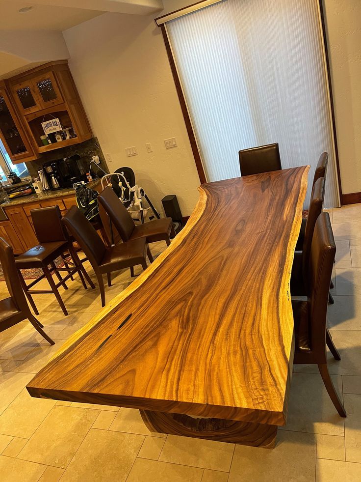 a large wooden table sitting in the middle of a room