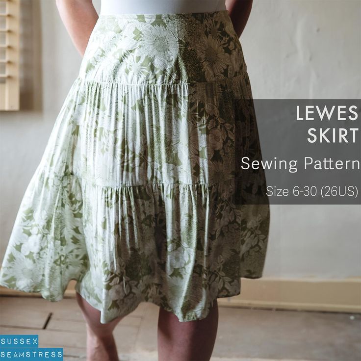 a woman wearing a skirt with flowers on it and the words sewing pattern below her