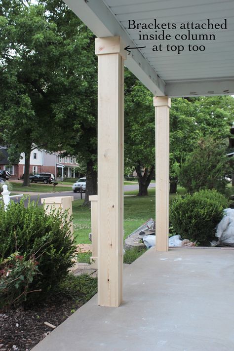 the porch is covered with wooden posts and has an attached side column at top too