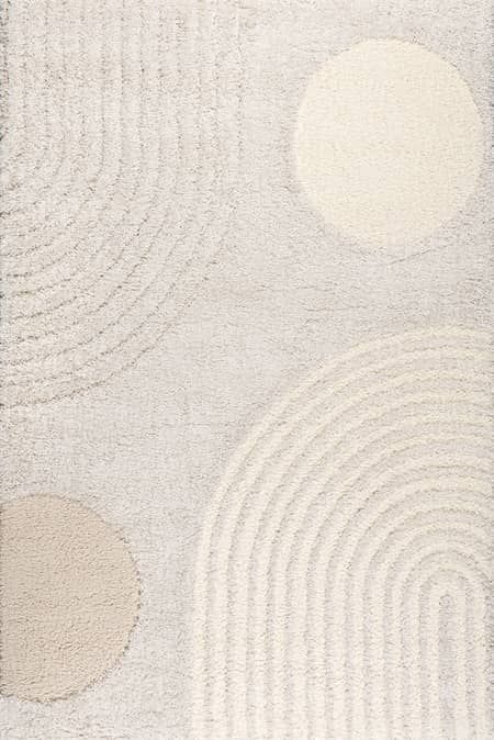 a white rug with circles on it