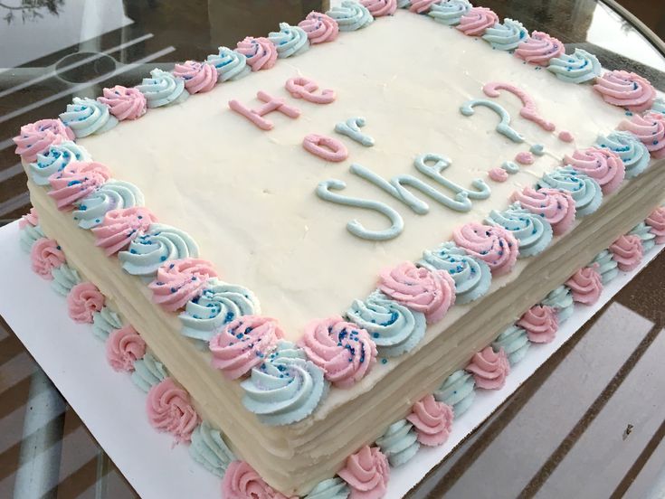 a birthday cake with pink and blue frosting