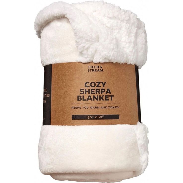 the cozy sherpa blanket is white and has a brown label on it