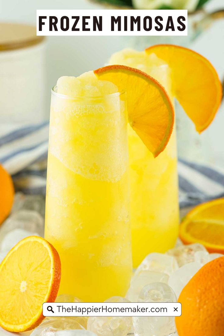 two glasses filled with frozen mimos on top of ice next to sliced oranges