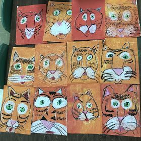 a group of cats painted on orange paper