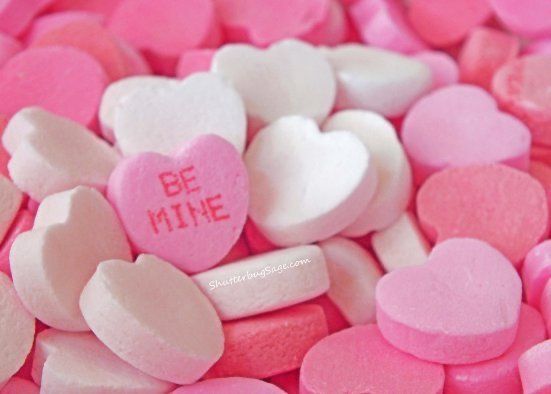 pink and white candy hearts with be mine written on them