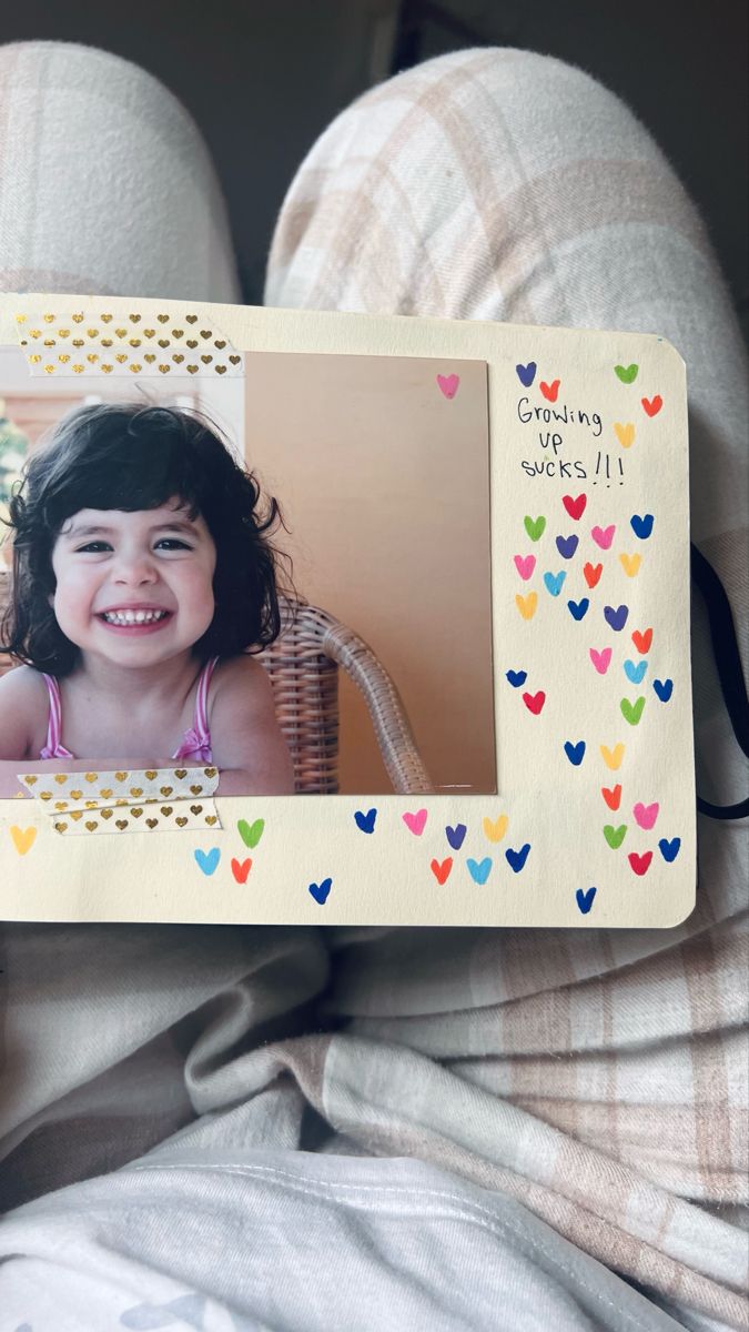 a child's photo frame with hearts on it