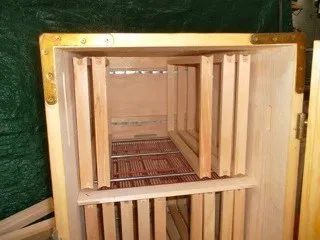 an empty wooden crate sitting inside of a room