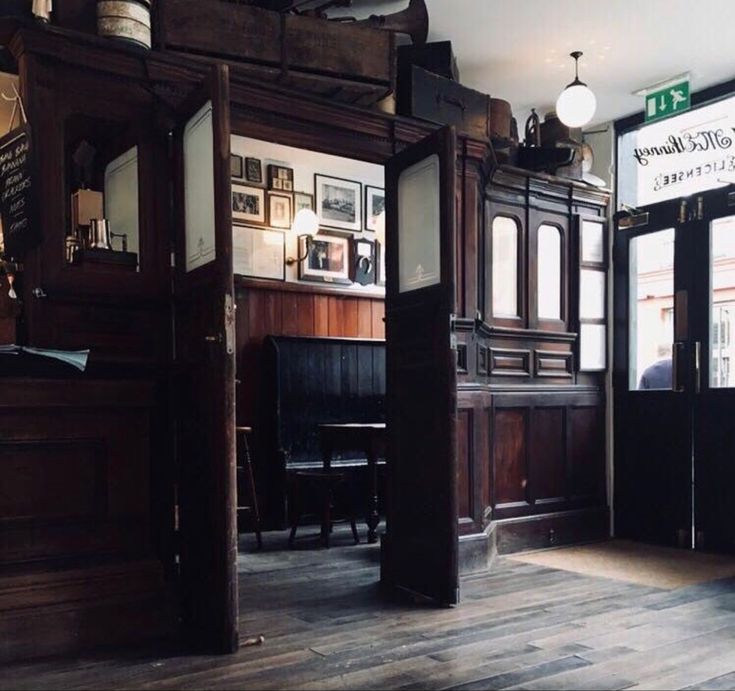 the inside of a restaurant with wooden floors