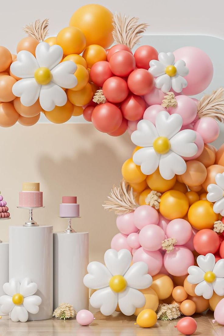 an arch made out of balloons and flowers