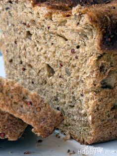 two pieces of bread sitting on top of a white plate next to some raisins