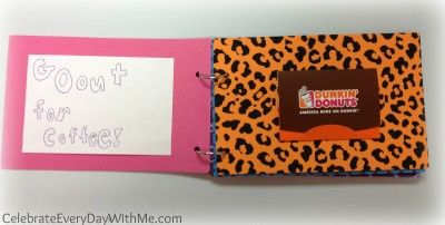 an orange and black leopard print book with writing on the front cover, and pink paper inside