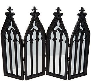 three black and white decorative mirrors with crosses on each one, set against a white background