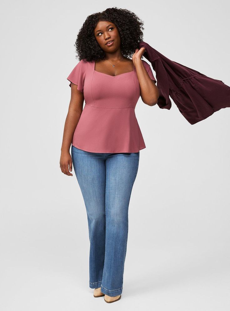 FIT Model is 5'10” wearing size 1. . Measures 28” from shoulder (size 2). MATERIALS + CARE Challis woven fabric: New, improved, and loved by all—and still lightweight, drapey, and (really! ) machine-washable. . Stretch level: None. . 82% rayon, 18% polyester. Machine wash cold. Line dry. Imported. DETAILS Sweetheart neckline. Short sleeves. Peplum detail. The best plus size women's peplum sweetheart top tops in wild ginger made of washchallis. Torrid is your destination for cozy fall and winter