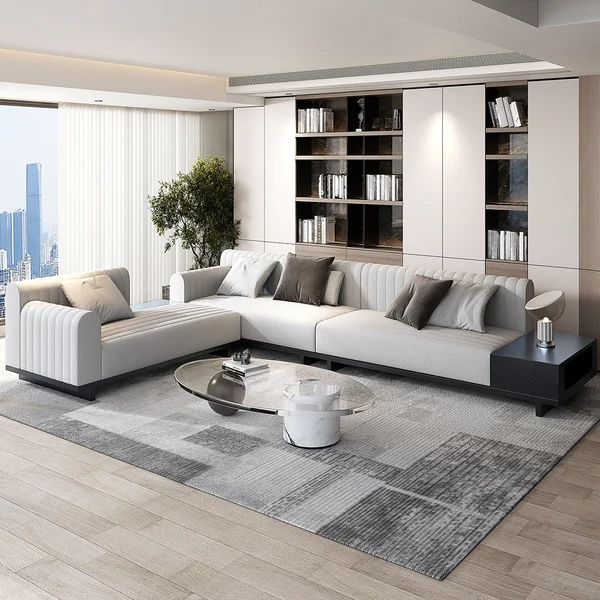 a modern living room with white and gray furniture