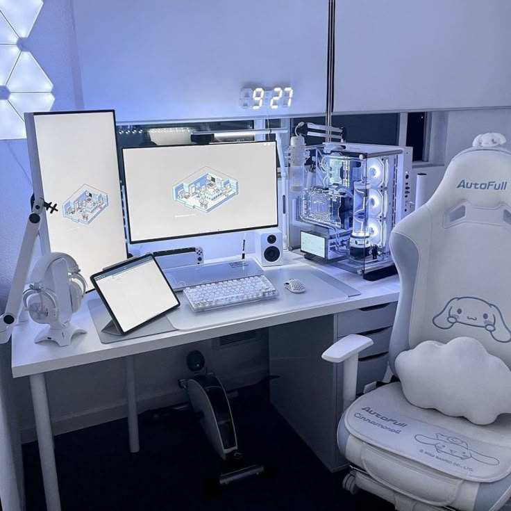 a computer desk with two monitors, keyboard and mouse on it in front of a white chair