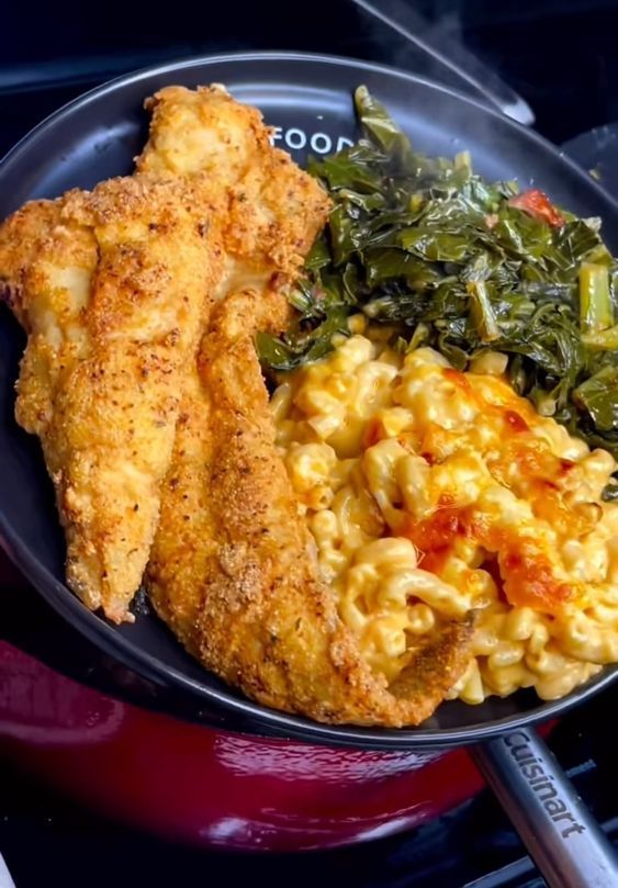 fried chicken, macaroni and greens on a plate