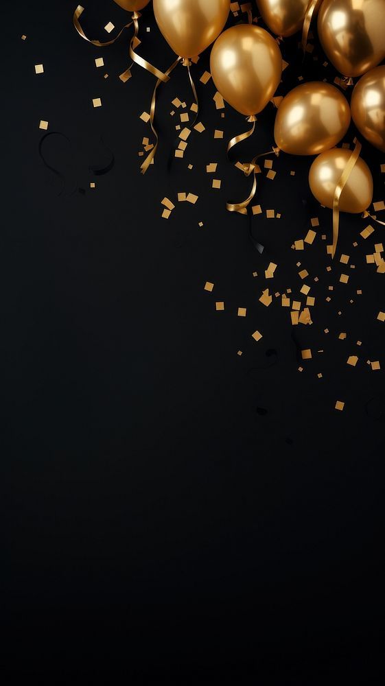 gold balloons and streamers on a black background with confetti in the air