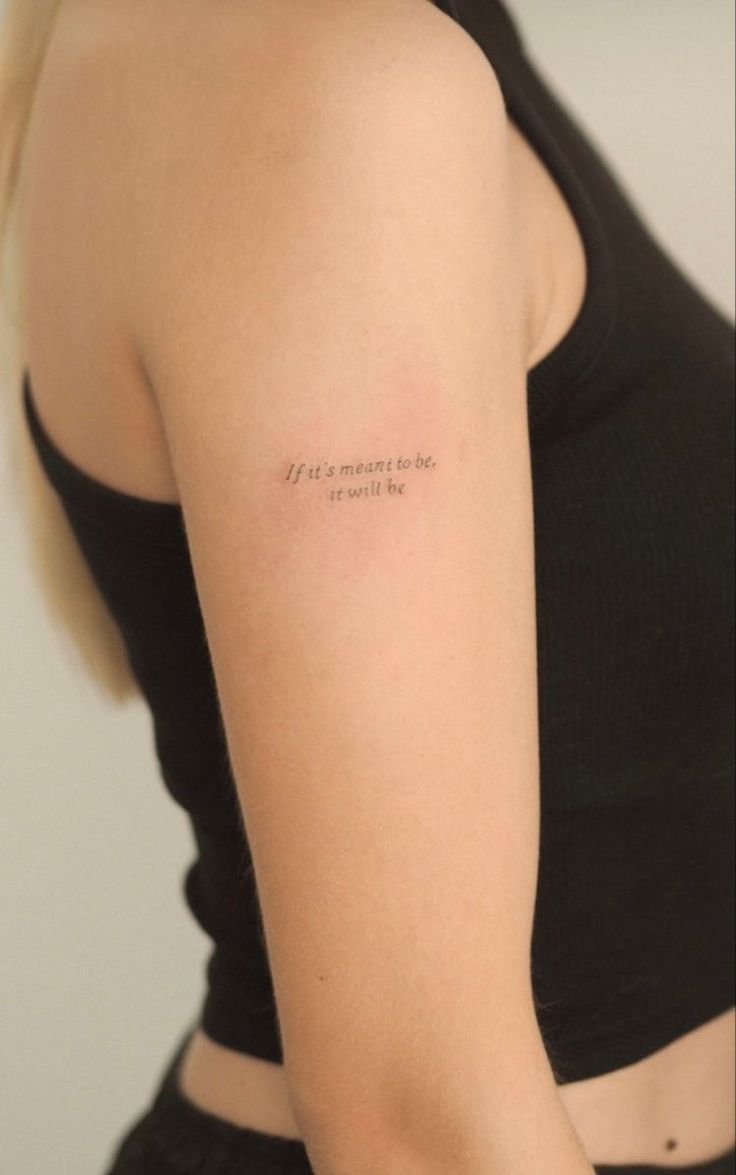 a woman with a small tattoo on her arm saying, let's move the world by yourself