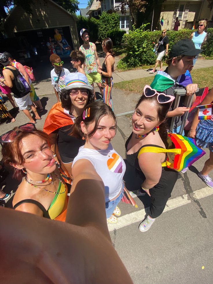 group of young women taking selfie in the street