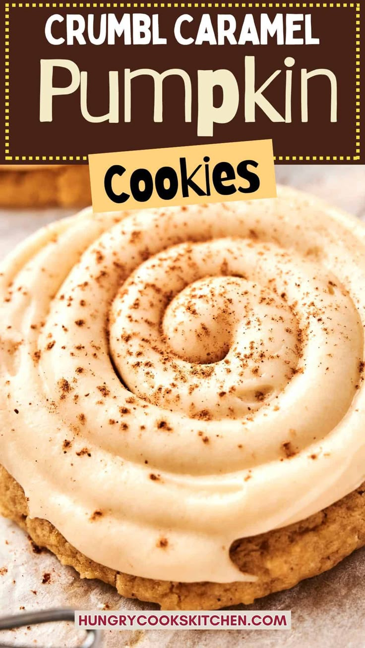 a close up of a cookie with frosting on it and the words, crumbl caramel pumpkin cookies