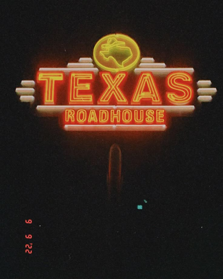 a neon sign that reads texas roadhouse