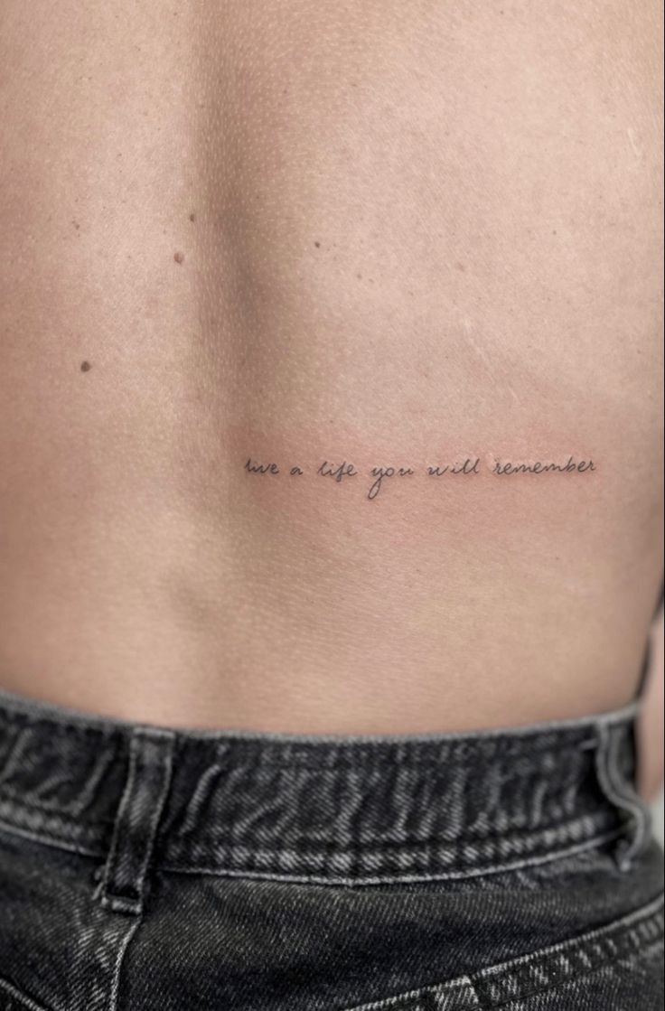 the back of a man's stomach with an inscription on it that says, we are